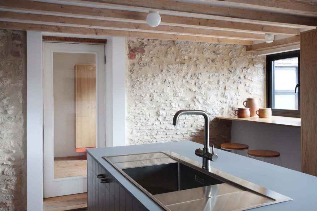 Kitchen island, bespoke kitchen, exposed stone walls, exposed timber joists, breakfast bar